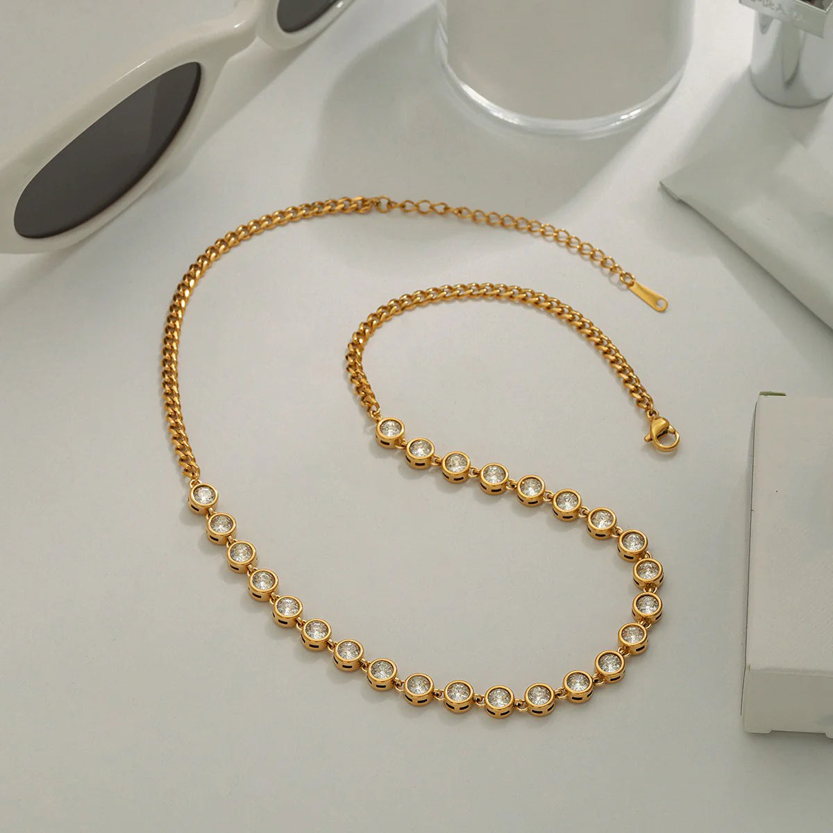 The Glimmer Anklet: 18K gold spheres on a durable titanium steel chain. Minimalist, lightweight, and versatile for everyday elegance.